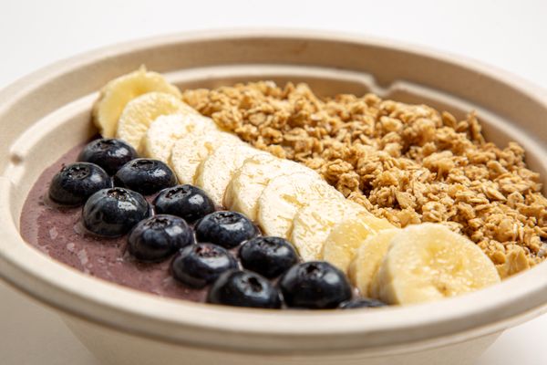 Handcrafted acai bowls - go for the acai berry bowl topped with fresh bananas, blueberries, and granola!