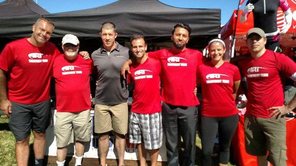 Dr Chuck, volunteer Active Release Techniques provider, helping athletes at Ironman Louisville 140.6 triathlon.