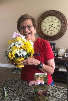 My bestest friend (81 years young) with her floral arrangement from Power of Flowers.