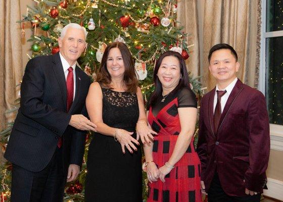 The Second Lady showing off Lee's work at the Vice President's Christmas Party.