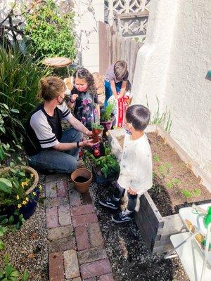 Primary students working in their garden