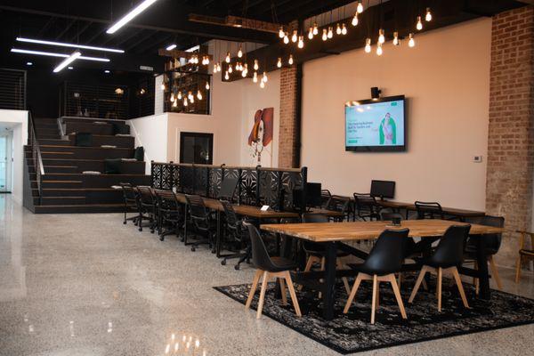 Our open area has multiple options for coworkers. We have bleacher seating, dedicated desks and our coworking table.