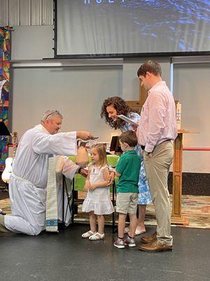 Baptism - we can do it by "pouring" (pictured above) or by full immersion (see another photo).