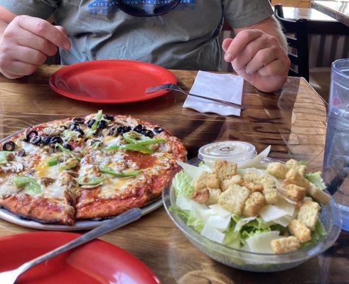 9" Supreme pizza and side Caesar salad.