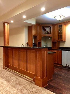 Finished basement bar/kitchen area in Canton.  Maple hardwood, granite counter-tops, wine cooler and even a beer tap!