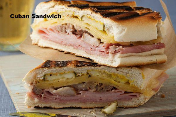 Cuban Sandwich ! Slow cooked pork loin ,Ham of the bone , Swiss cheese ,pickles,red onion , mstard dressing.