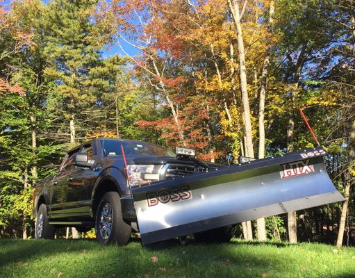 2016 Ford F-150 BOSS 7.5" HTX stainless steel plow attached.