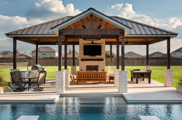 Outdoor custom cedar pavilion, dining and lounging areas, pool views.