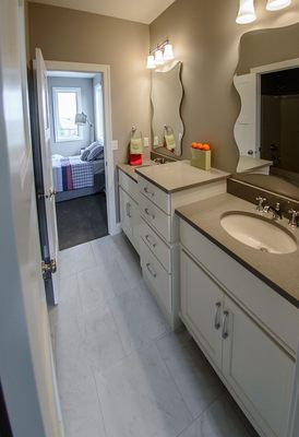 Quartz is a durable material for Jack & Jill bathrooms.