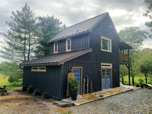 Wood cabin painted black and leather....