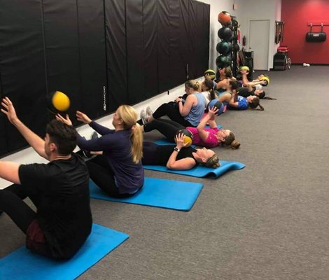 Working your core using weighted balls.