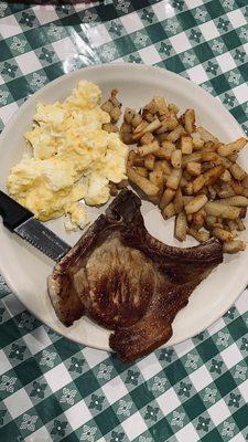 Pork chop, soft scrambled eggs & potatoes