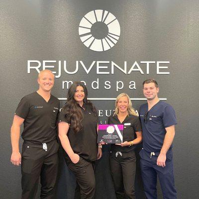 Image of Rejuvenate MedSpa Golden staff receiving an award for our HALO laser treatments