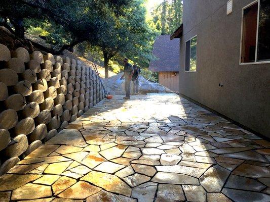 Slate Stone Patio with a Dry Stack Block Planting Wall with Irrigation