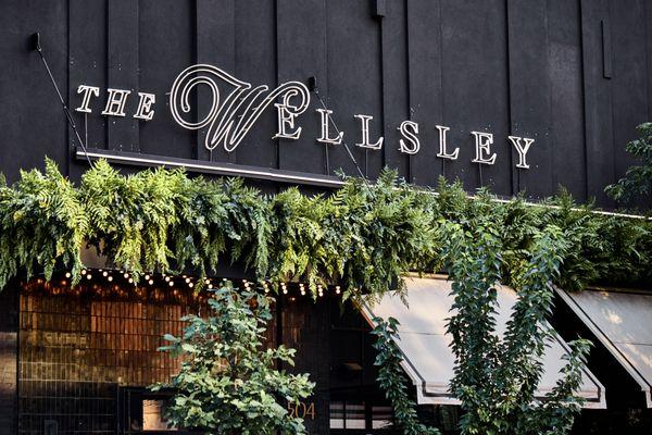 The Wellsley private event venue entryway with lush green plants. Perfect for private parties, conferences, weddings, and engagement parties