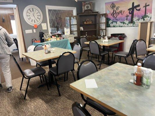 Dining area. There's also a gathering room in the back with checkers, tables, and a microwave.