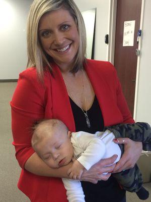 Kara working her baby magic, stretching my baby's neck while also getting him to take a nap. Multitasking at its finest.