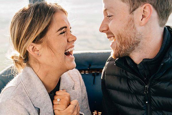 A happy couple taking a hot air balloon tour with Snowbird Air Balloon Rides.