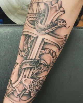 black and gray snake and cross