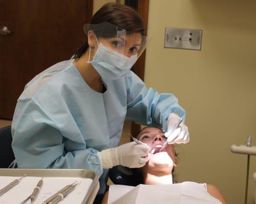 Dr. Triana doing an exam, there's a smile under there :)