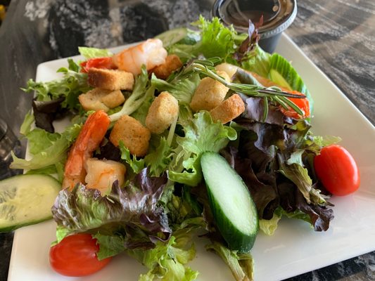 Salad with grilled shrimp.