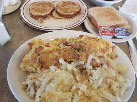 Tons of hash browns, omelette, and delicious cinnamon french toast.