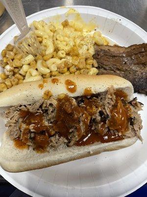 Smoked pulled pork sandwich, smoked brisket , smoked Mac n cheese, smoked corn