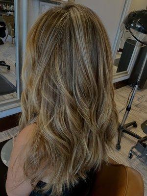 Blonding by Nori with soft Hollywood waves.