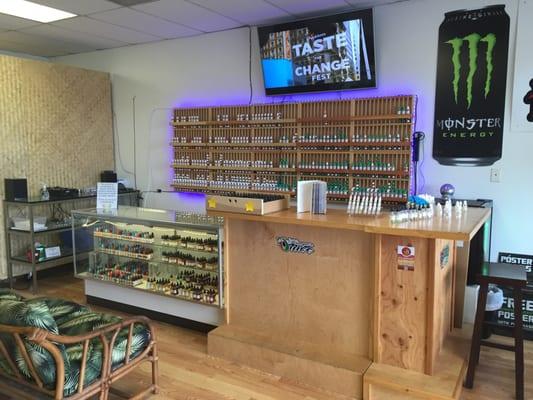 lots of ejuice selection with a sample bar and a big screen tv and couch to relax