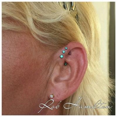 Triple forward helix with mint green gemstones from NeoMetal.