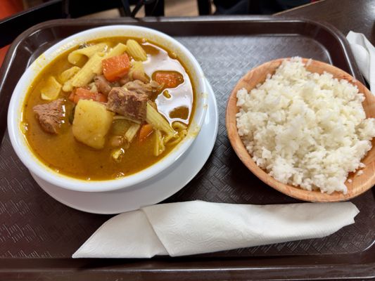 Minestrone soup with a plate of white rice.