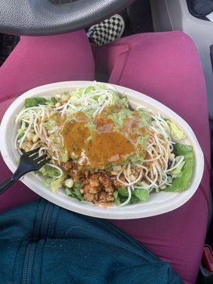 Salad with sofritas (tofu), black beans, corn salsa, cheese, guac, and Chipotle salad dressing.