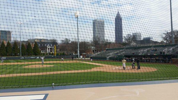 View from first row behind 3rd base dugout, section 8