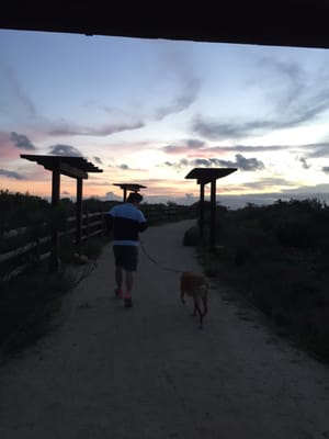 Just a simple walking trail that forks off uphill to the right; leads you east and out to the other side. Dog friendly!