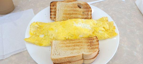 Meat and cheese omelet with sausage and Swiss cheese and sour dough bread