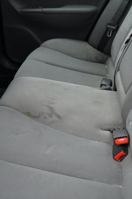 Hyundai Sonata rear seat with stains (before).