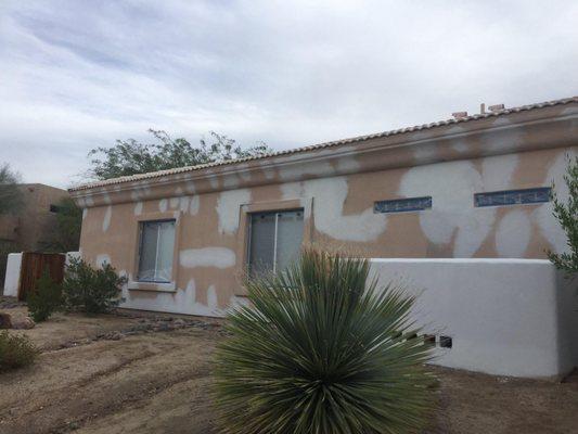 Exterior stucco repair and repaint.