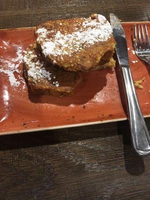 Delicious partially eaten bread pudding French toast