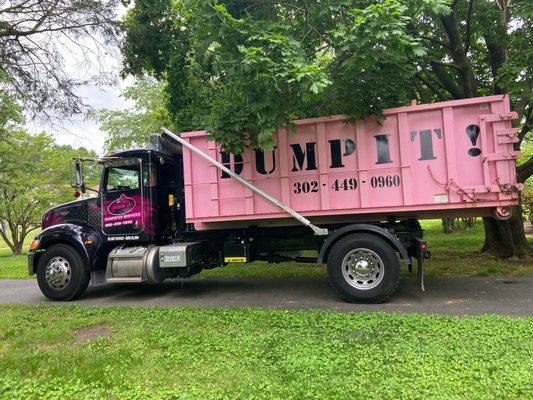 Dump it roll off dumpster rental truck and can for delivery.