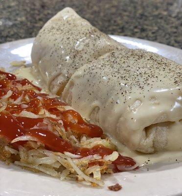 Sausage wrap with queso smothered over the top as an add on!