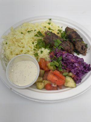 Kofta platter with purple cabbage salad and white sauce