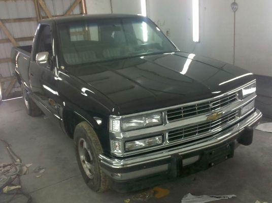 A freshly repainted 1990 Chevy C1500 with an upgraded aftermarket 1994 grill installed.