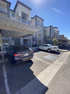 you can see A the number above on the covered parking space. B you can see the lines in the space im in and the handicap is painted black.