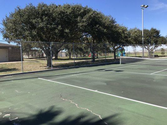 Tennis courts looking at pool and playground.