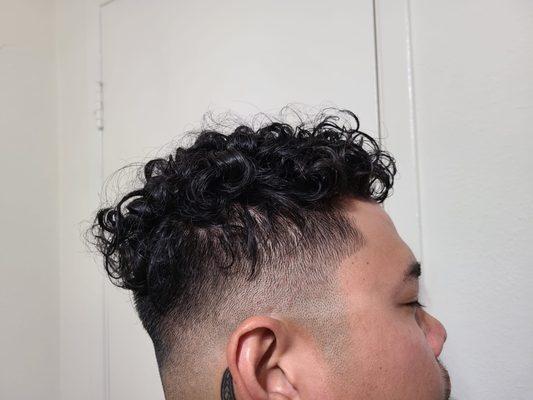 Side view of my perm with a mid fade with my original barber