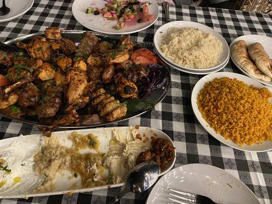 Mixed grill combo of chicken, beef and lamb, along with the couscous and rice (in the plates on the right).