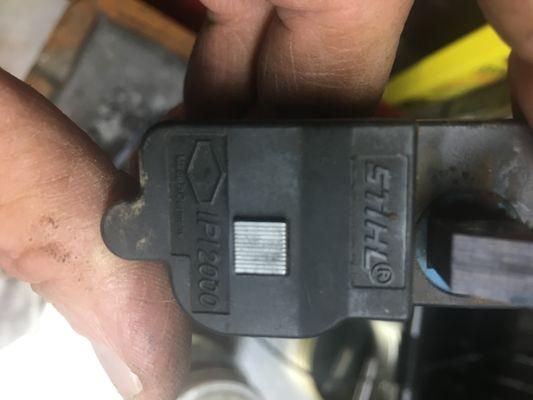 OEM replacement ignition coil for a saw