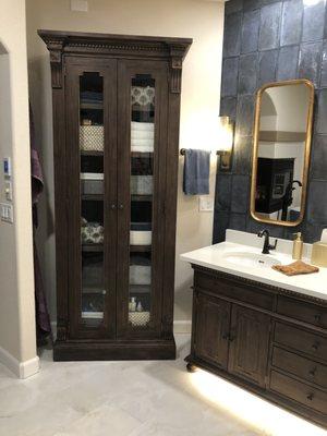 RH furniture vanity and tall cabinet storage.