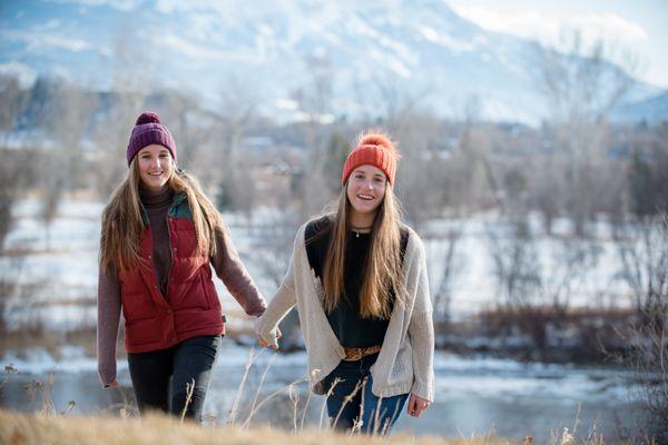 Sisterly love captured with the majestic backdrop of Mt. Sopris