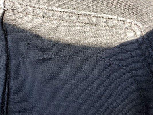 Same pocket, chose a different method of stitching then got out of the line near the curve. Horrible work! Dont go here